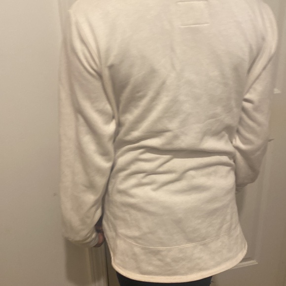 A white sweater with a leopard print sight saying ny - Picture 3 of 5